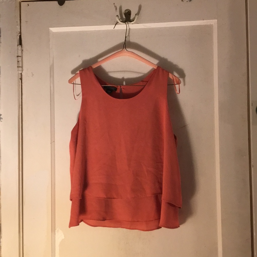 Peach colored sleeveless top